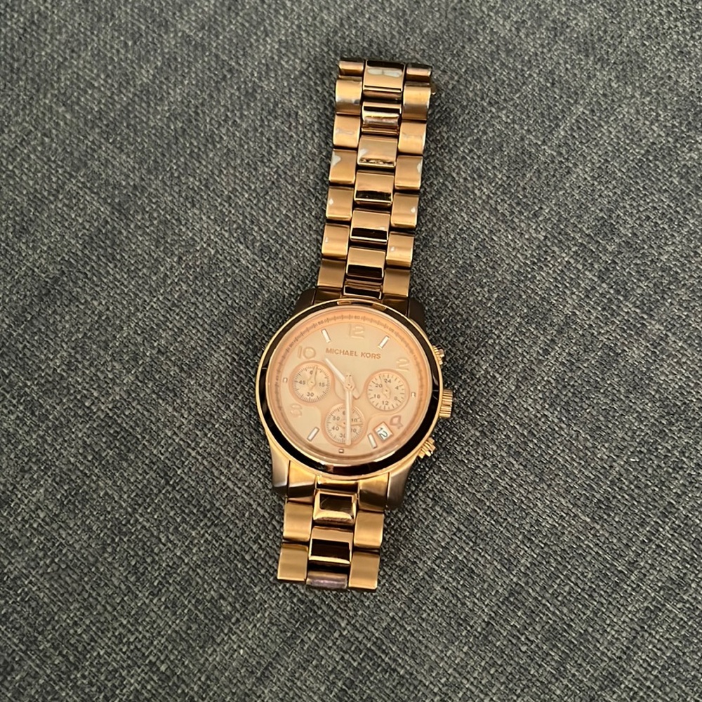 Used rose gold Women’s Michael Kors watch.